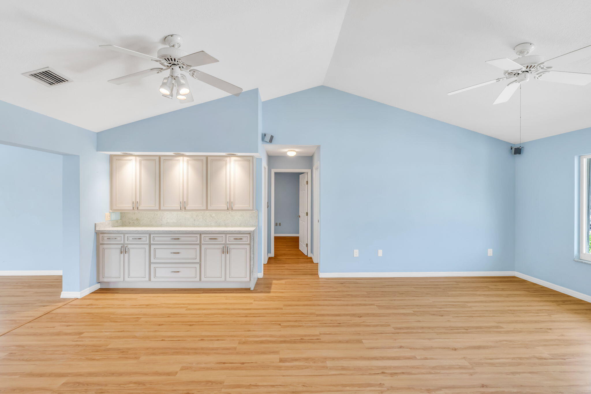 501 11th Street Key Colony Beach, FL 33051 - Photo 20 of 52 a view of an empty room with cabinet and a ceiling fan