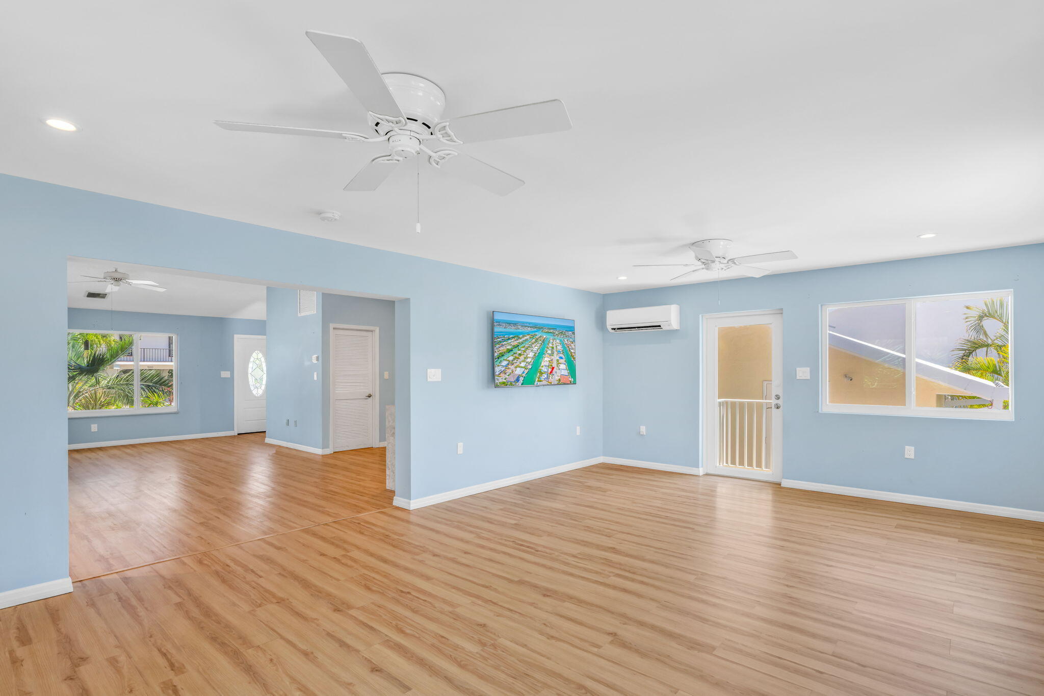 501 11th Street Key Colony Beach, FL 33051 - Photo 22 of 52 an empty room with wooden floor and windows