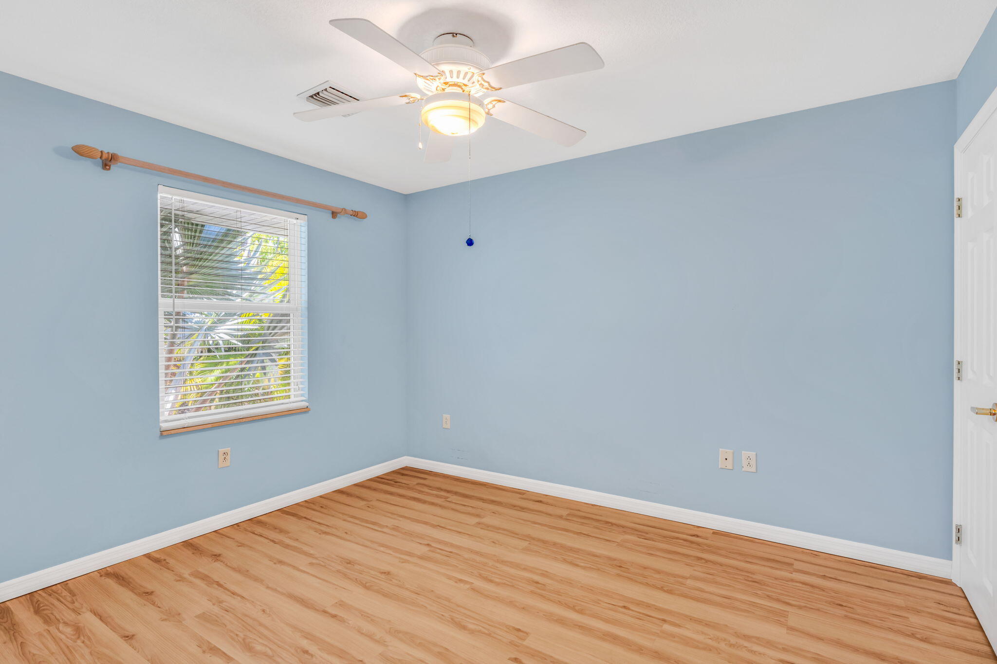 501 11th Street Key Colony Beach, FL 33051 - Photo 34 of 52 an empty room with a window and a fan