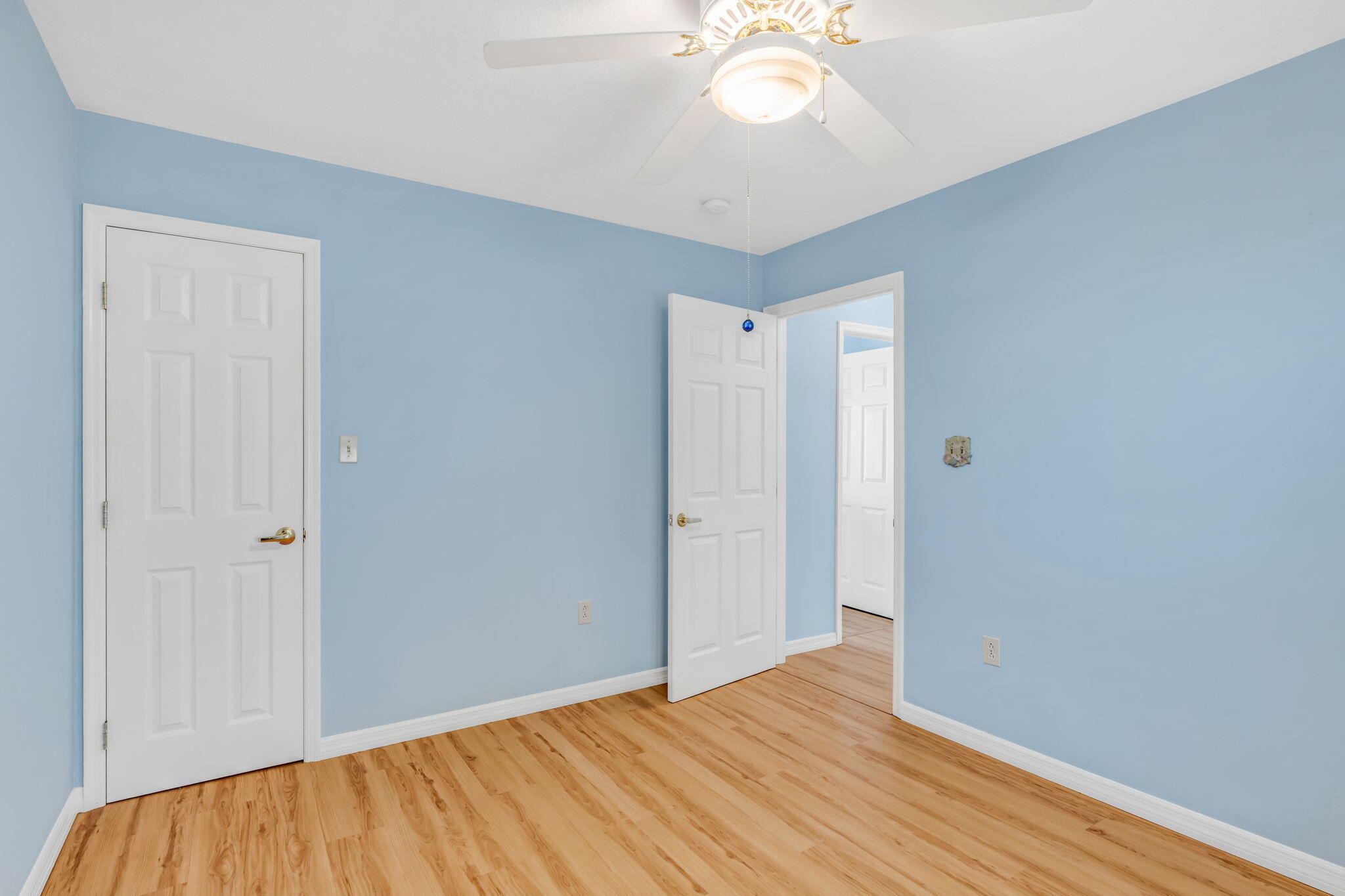 501 11th Street Key Colony Beach, FL 33051 - Photo 35 of 52 a view of an empty room with wooden floor