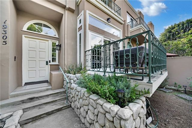 a view of building with glass windows and door