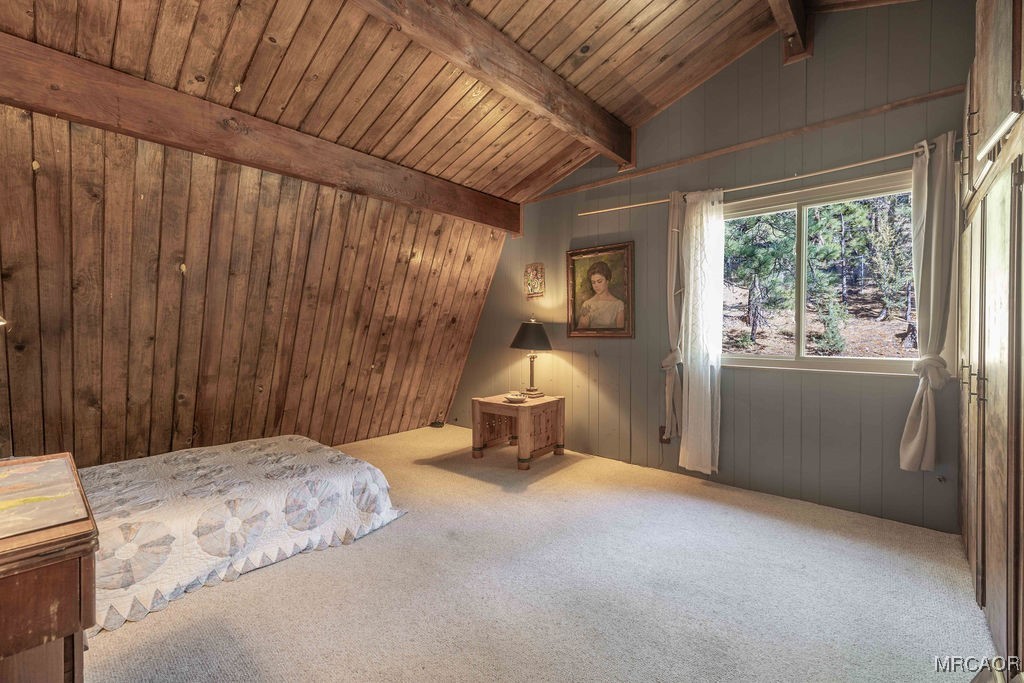 44185 Tim Ron Sugarloaf, CA 92386 - Photo 22 of 45 a bedroom with a bed and wooden floor