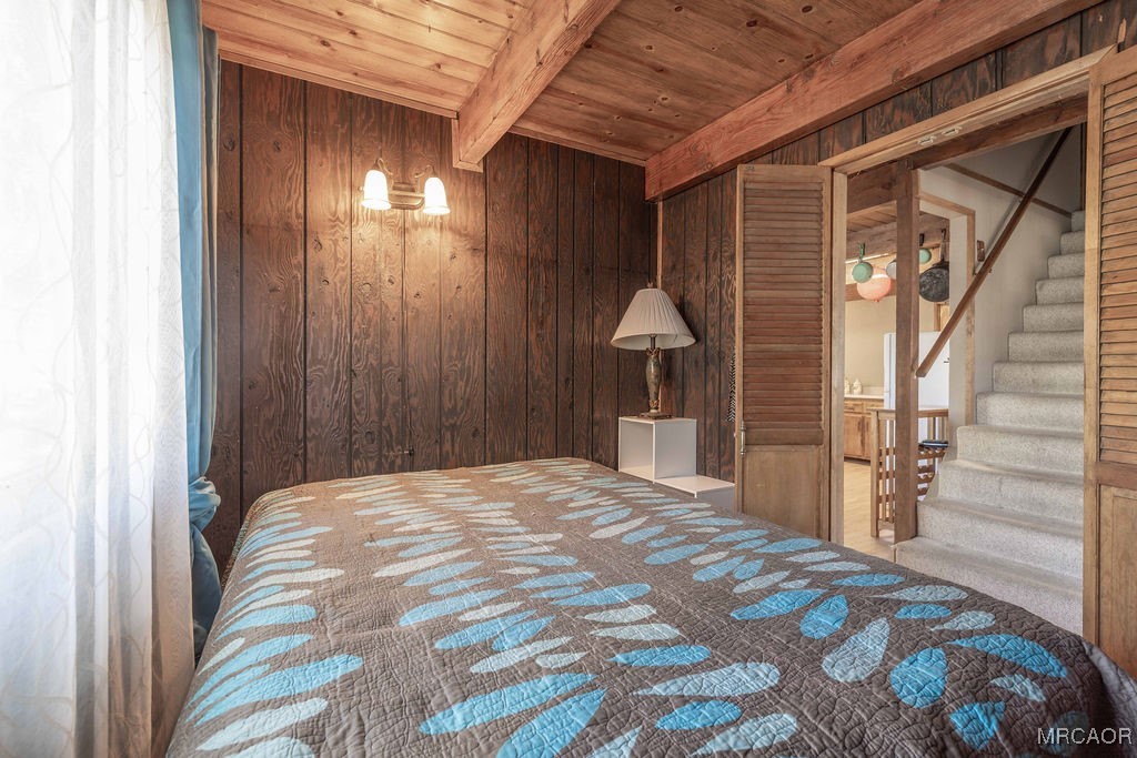 44185 Tim Ron Sugarloaf, CA 92386 - Photo 26 of 45 a bedroom with a bed and a view of bathroom