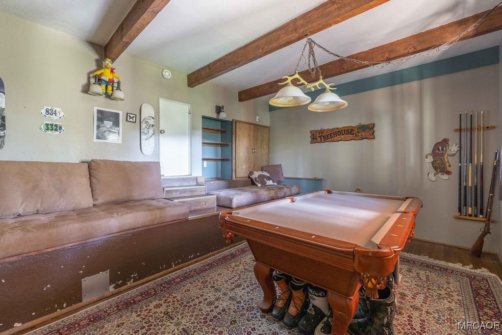 44185 Tim Ron Sugarloaf, CA 92386 - Photo 28 of 45 a living room with stainless steel appliances furniture a chandelier and a rug