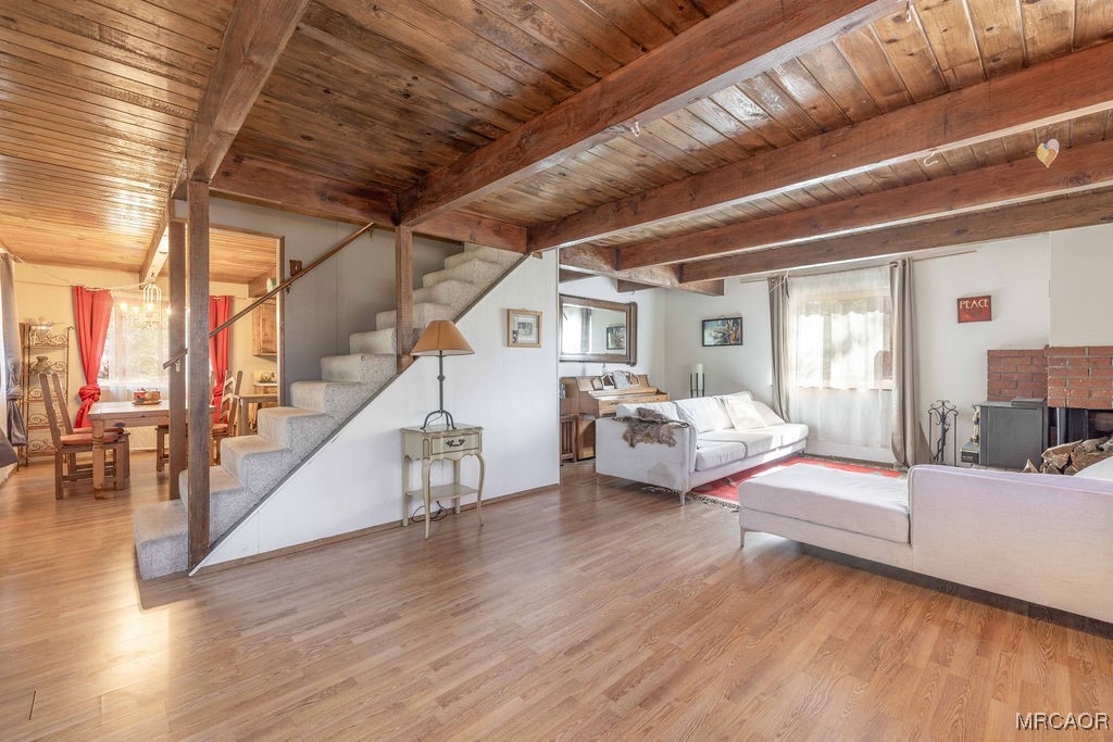 44185 Tim Ron Sugarloaf, CA 92386 - Photo 8 of 45 a bedroom with furniture and a wooden floor