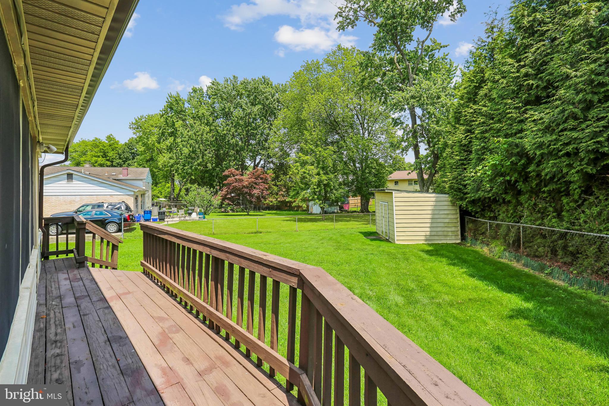 2 Foxhall Court Silver Spring, MD 20906 - Photo 81 of 86 a view of a deck and backyard with large trees
