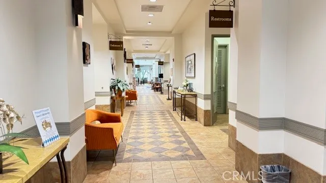 a lobby with furniture and rug