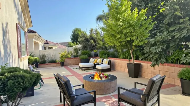 a view of a patio with table and chairs and potted plants