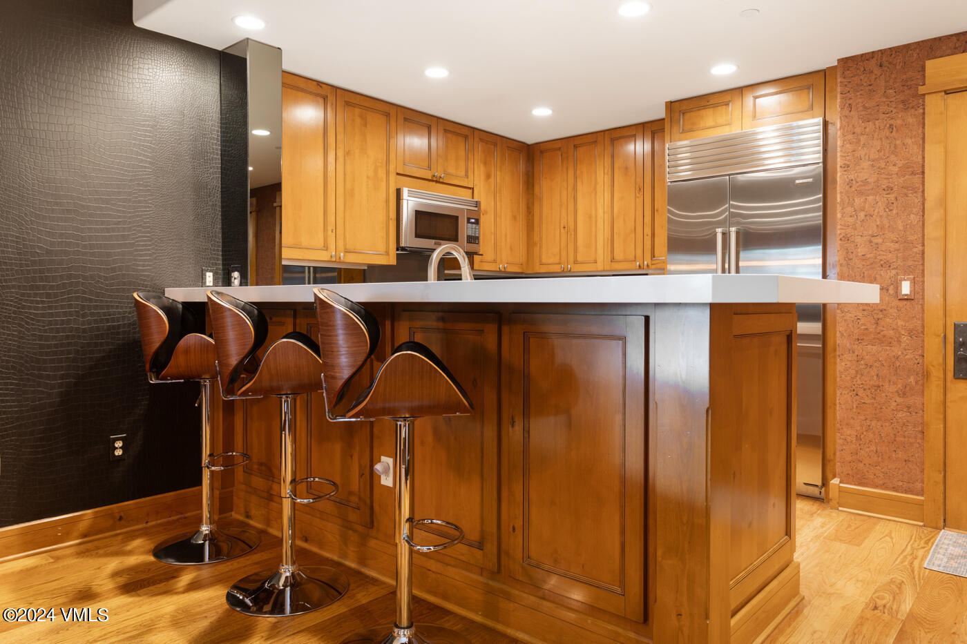 1087 Bachelor Ridge Road, Unit 104 Avon, CO 81620 - Photo 11 of 36 a kitchen with stainless steel appliances granite countertop a sink and cabinets