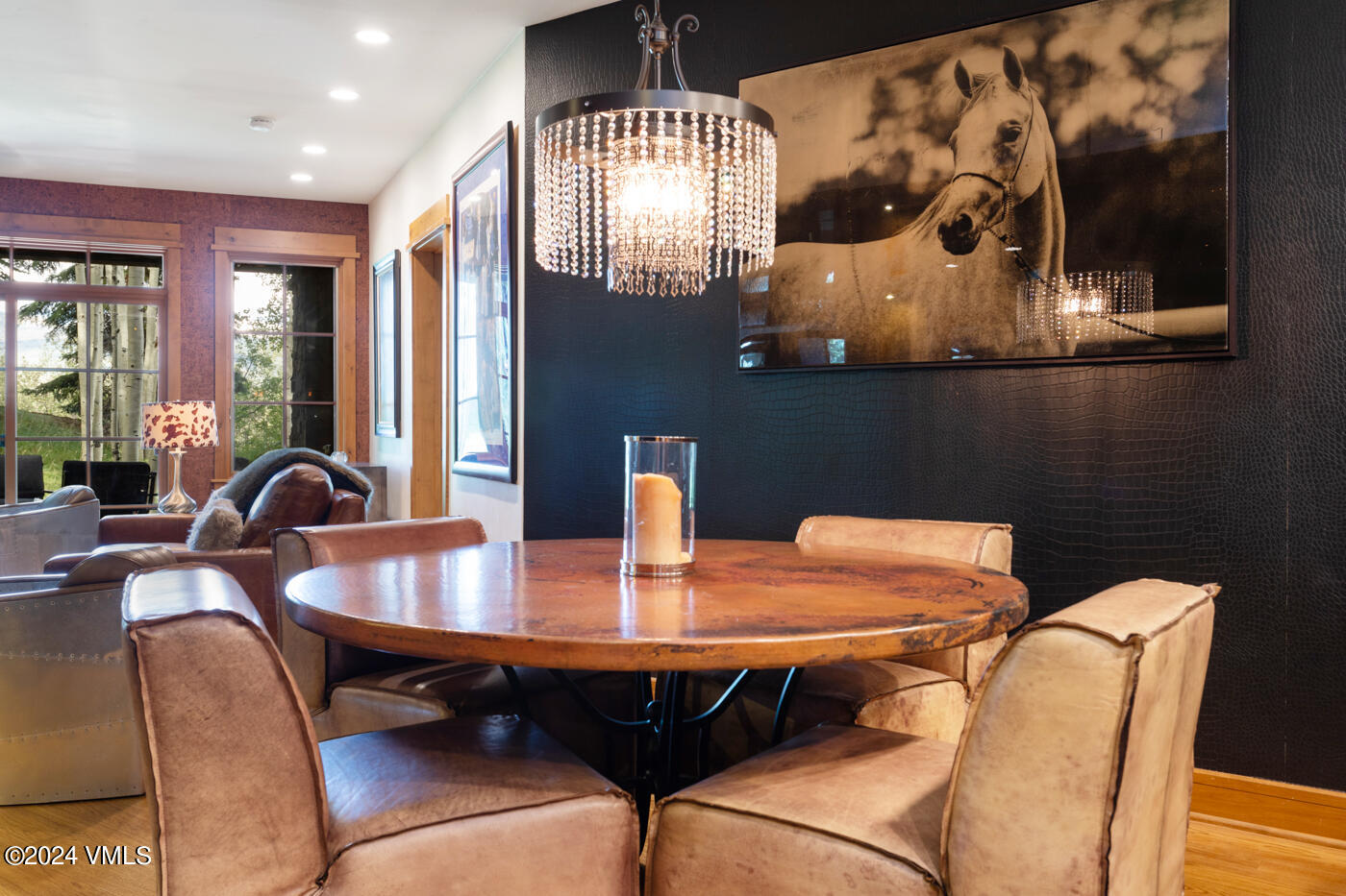 1087 Bachelor Ridge Road, Unit 104 Avon, CO 81620 - Photo 15 of 36 a view of a dining room with furniture and chandelier