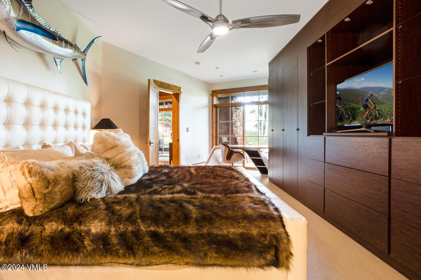 1087 Bachelor Ridge Road, Unit 104 Avon, CO 81620 - Photo 17 of 36 a bedroom with a bed and a painting on the wall