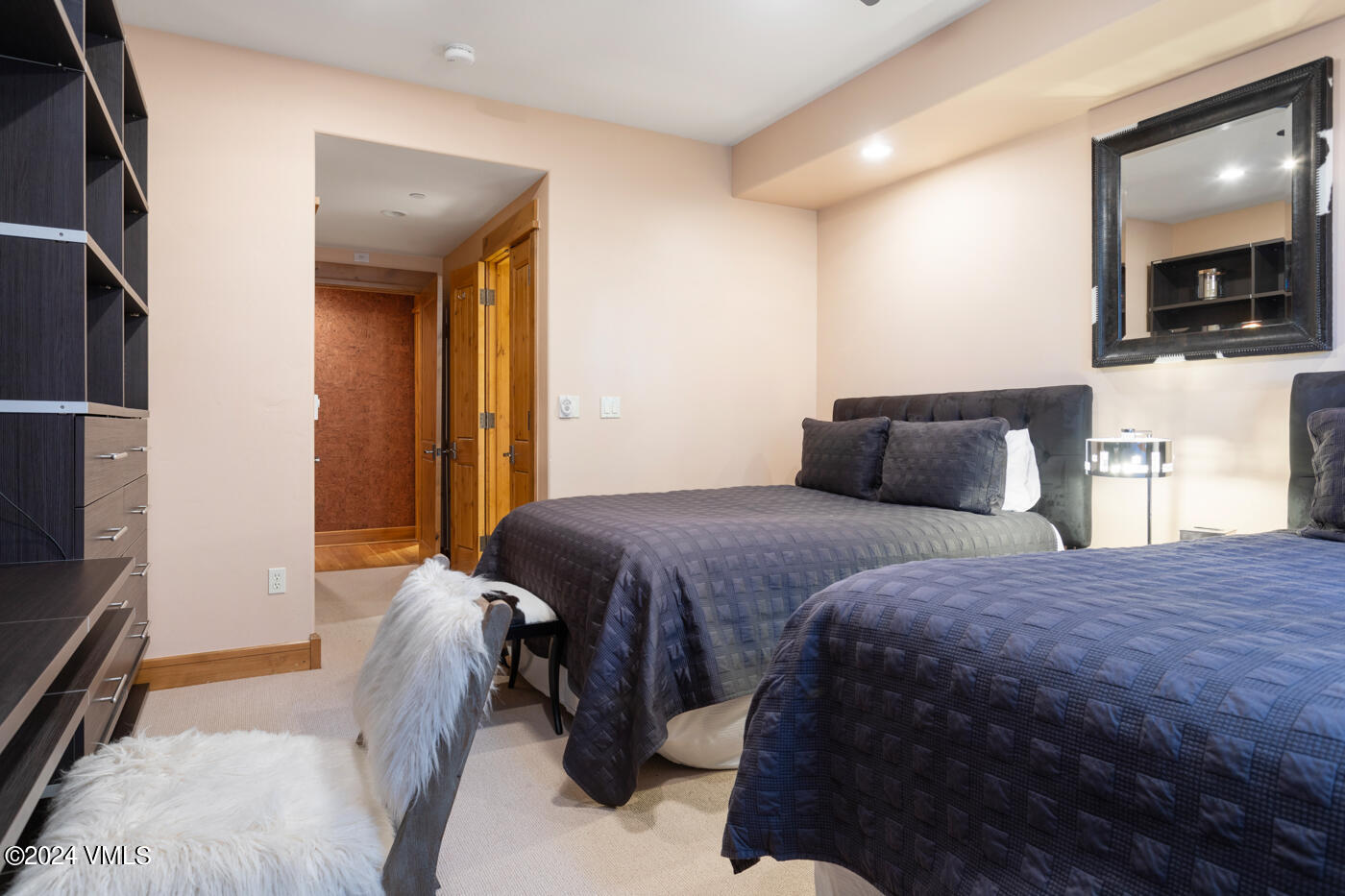1087 Bachelor Ridge Road, Unit 104 Avon, CO 81620 - Photo 25 of 36 a bedroom with a bed and a television
