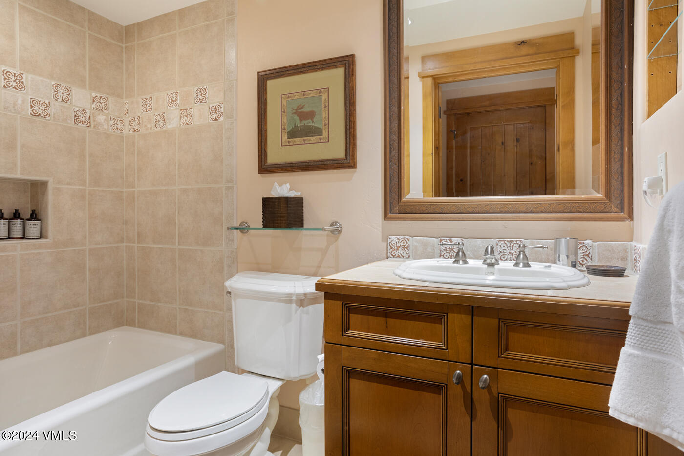 1087 Bachelor Ridge Road, Unit 104 Avon, CO 81620 - Photo 27 of 36 a bathroom with a sink a toilet and a bathtub