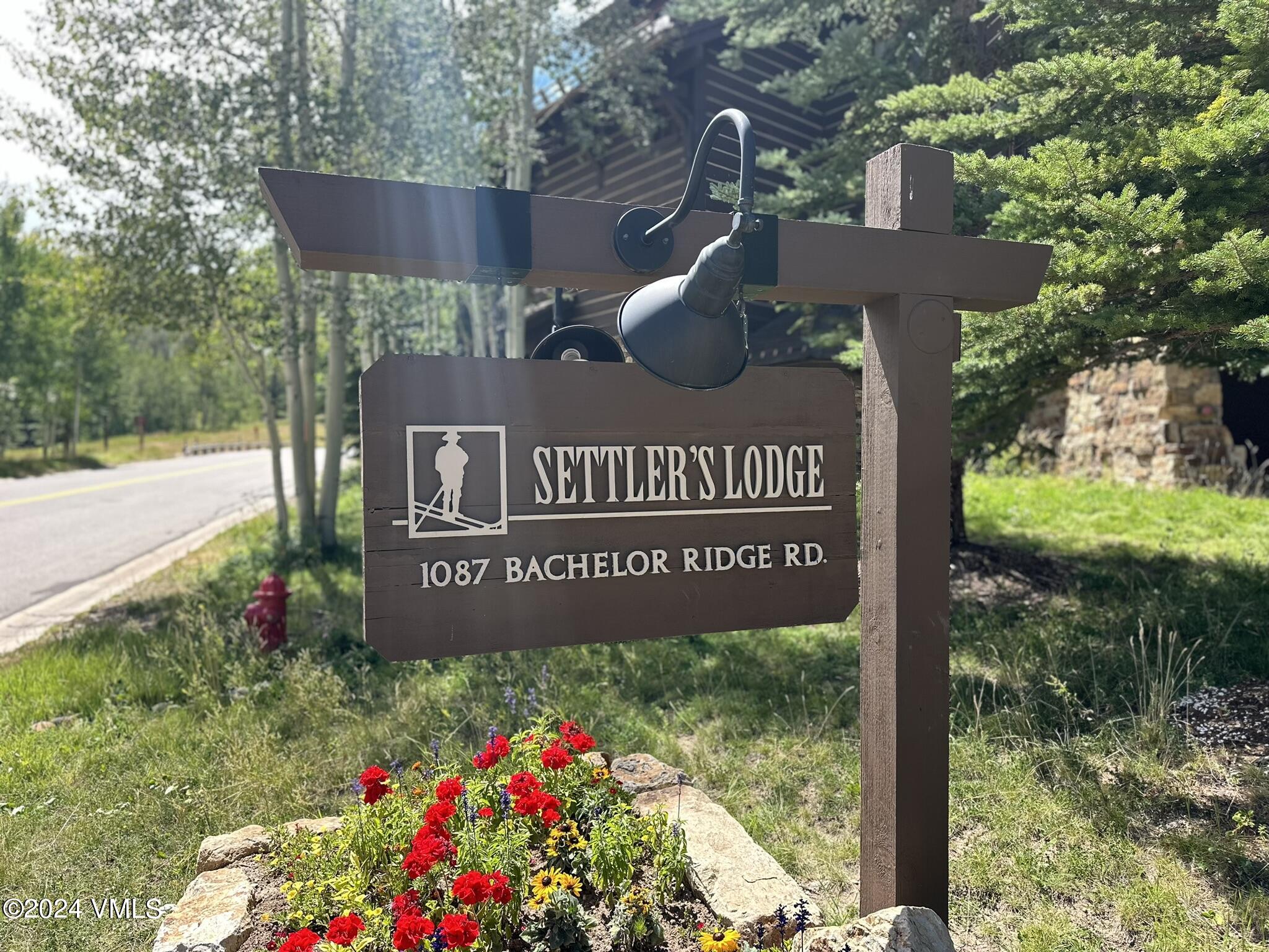 1087 Bachelor Ridge Road, Unit 104 Avon, CO 81620 - Photo 35 of 36 a sign on the side of the road