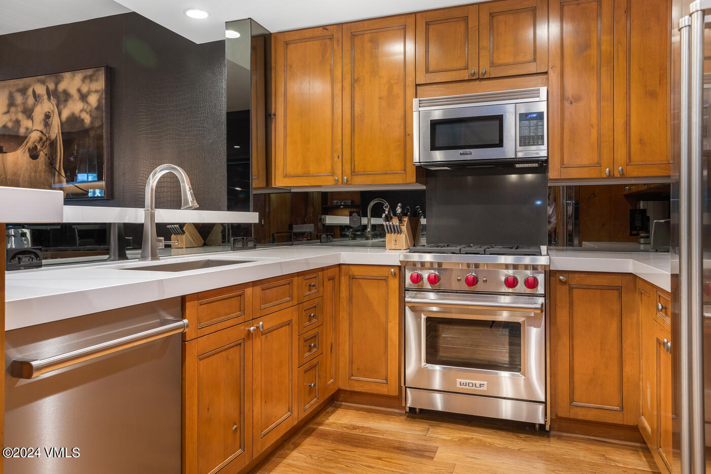 1087 Bachelor Ridge Road, Unit 104 Avon, CO 81620 - Photo 9 of 36 a kitchen with stainless steel appliances granite countertop a stove a microwave and a sink