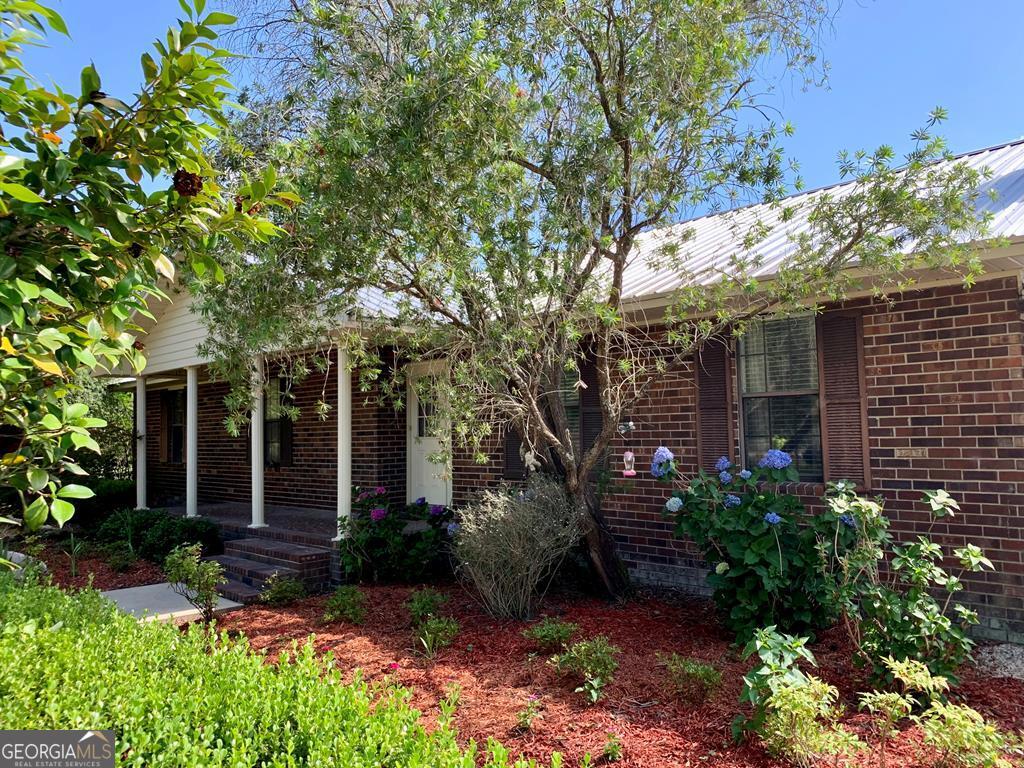 254 Smart Baxley, GA 31513 - Photo 1 of 1 front view of a house with a tree