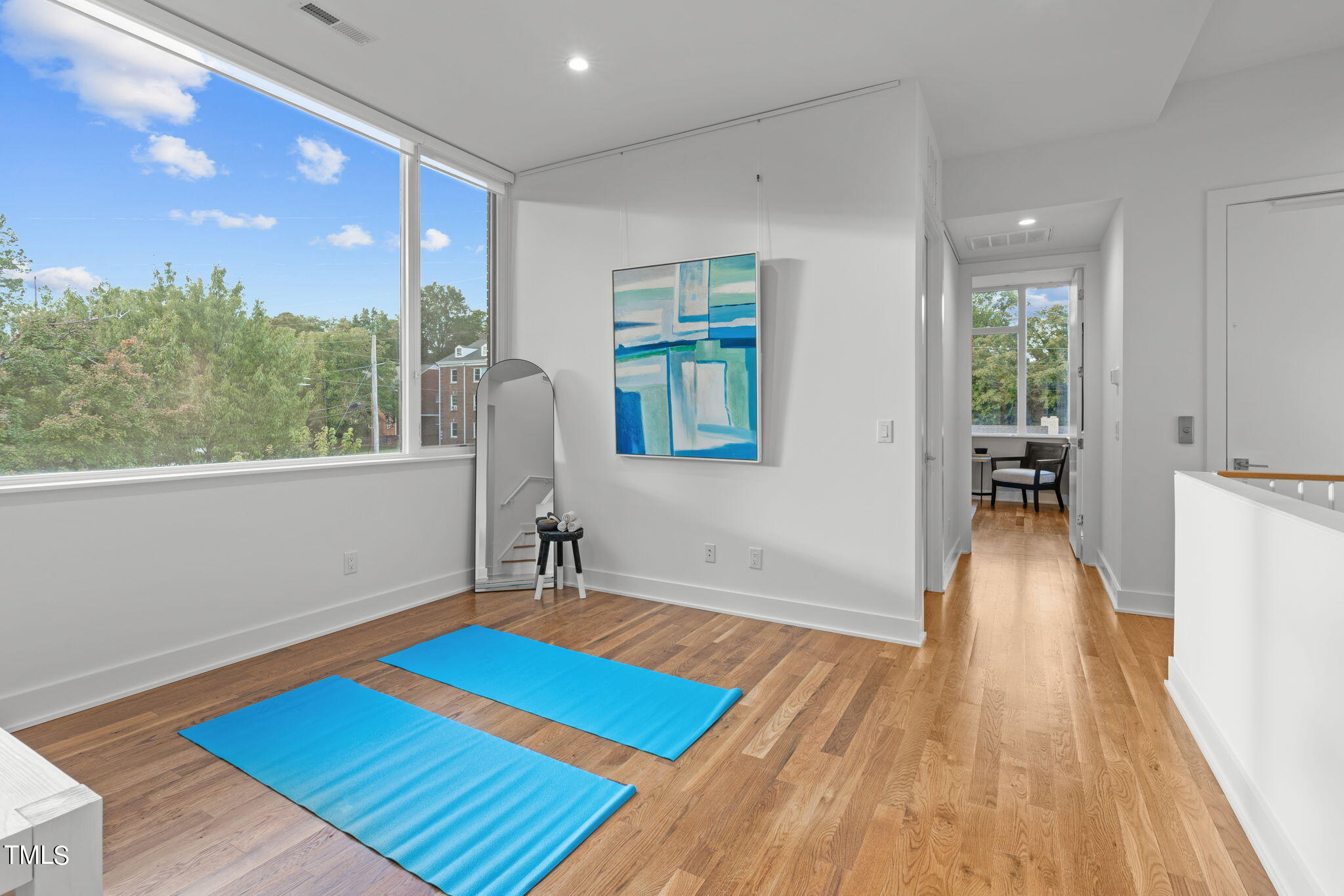 2329 Clark Avenue Raleigh, NC 27607 - Photo 13 of 34 a living room with furniture and a wooden floor