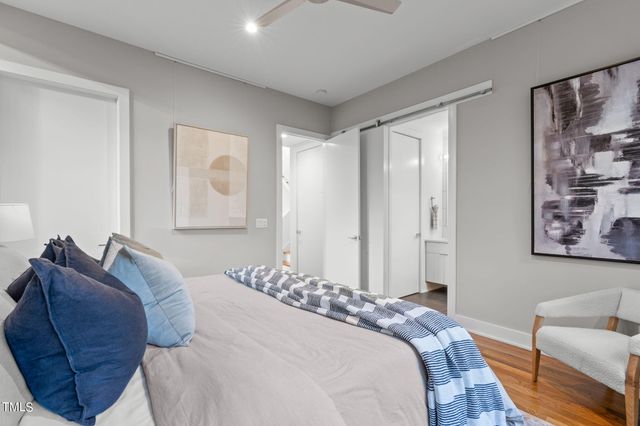 a bedroom with a bed and a couch