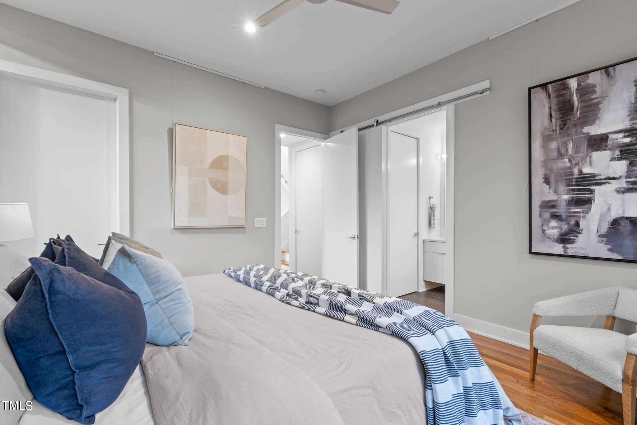 2329 Clark Avenue Raleigh, NC 27607 - Photo 16 of 34 a bedroom with a bed and a couch