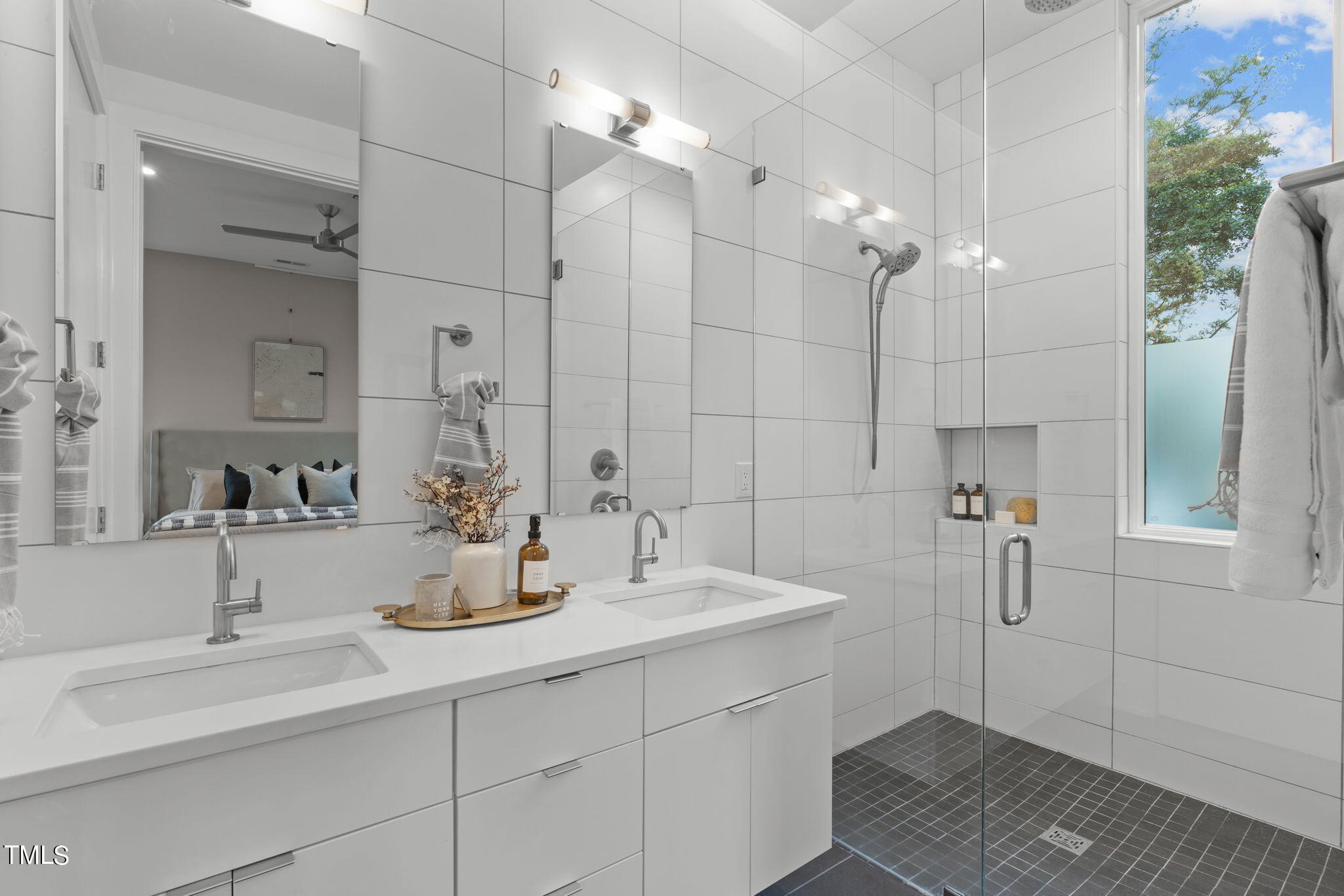 2329 Clark Avenue Raleigh, NC 27607 - Photo 17 of 34 a bathroom with a double vanity sink mirror and shower