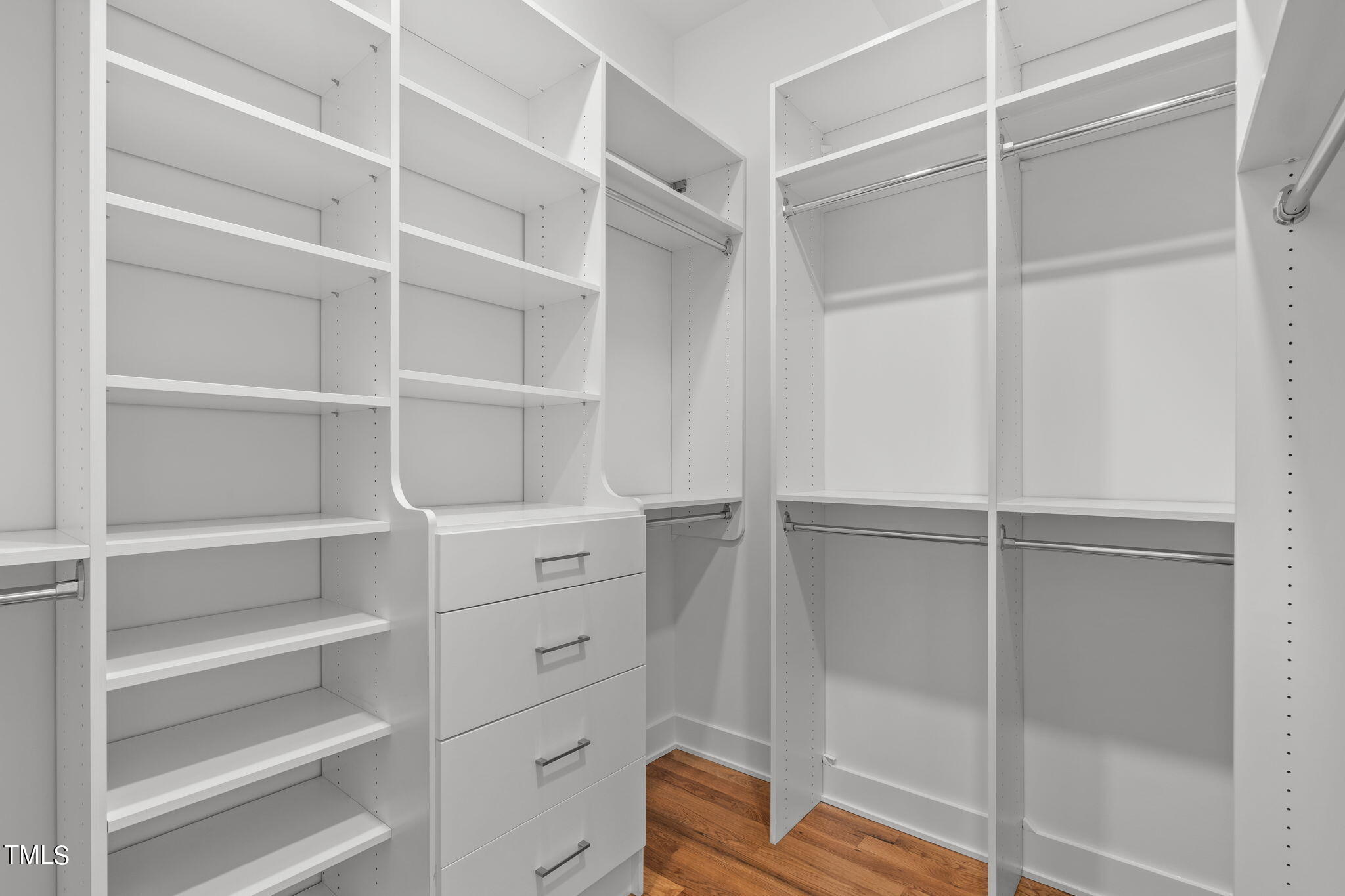 2329 Clark Avenue Raleigh, NC 27607 - Photo 18 of 34 a view of walk in closet with empty racks