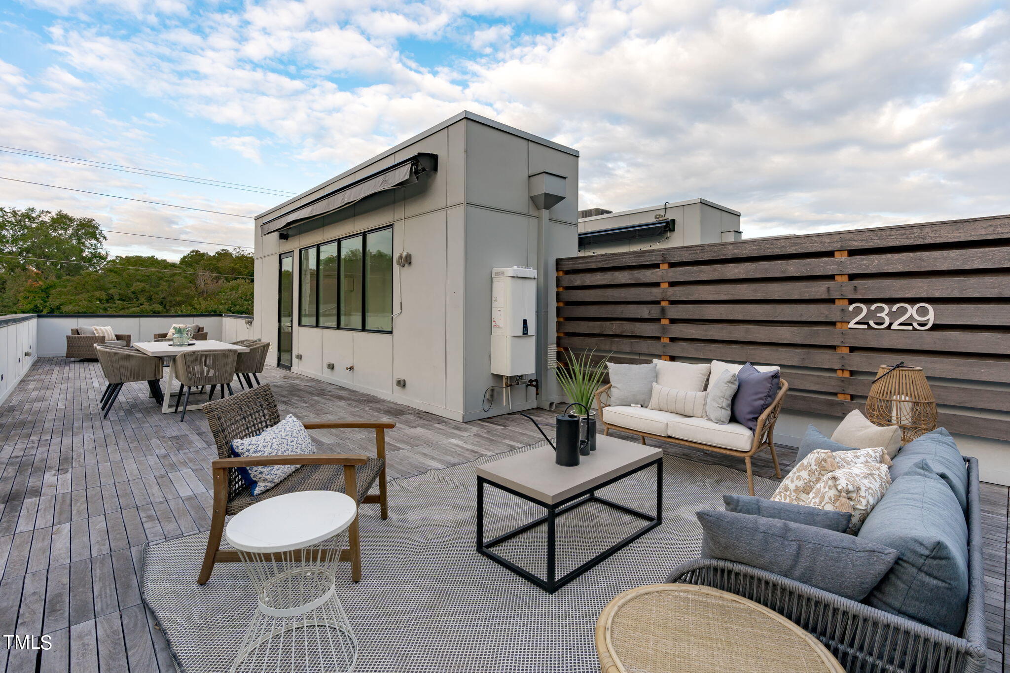 2329 Clark Avenue Raleigh, NC 27607 - Photo 2 of 34 a balcony with furniture and a city view