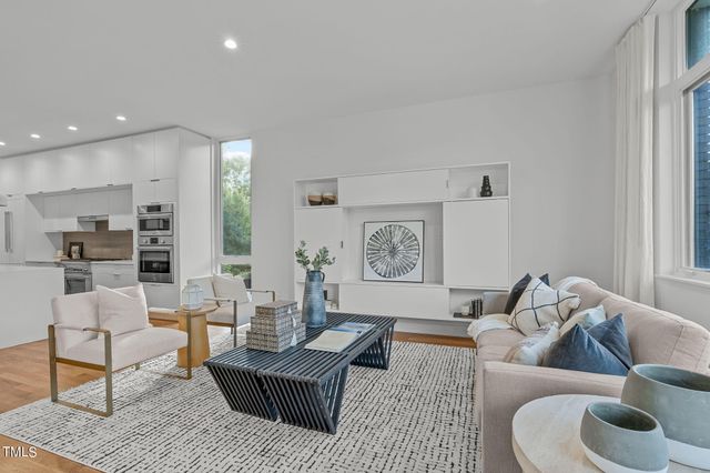 a living room with furniture and a rug