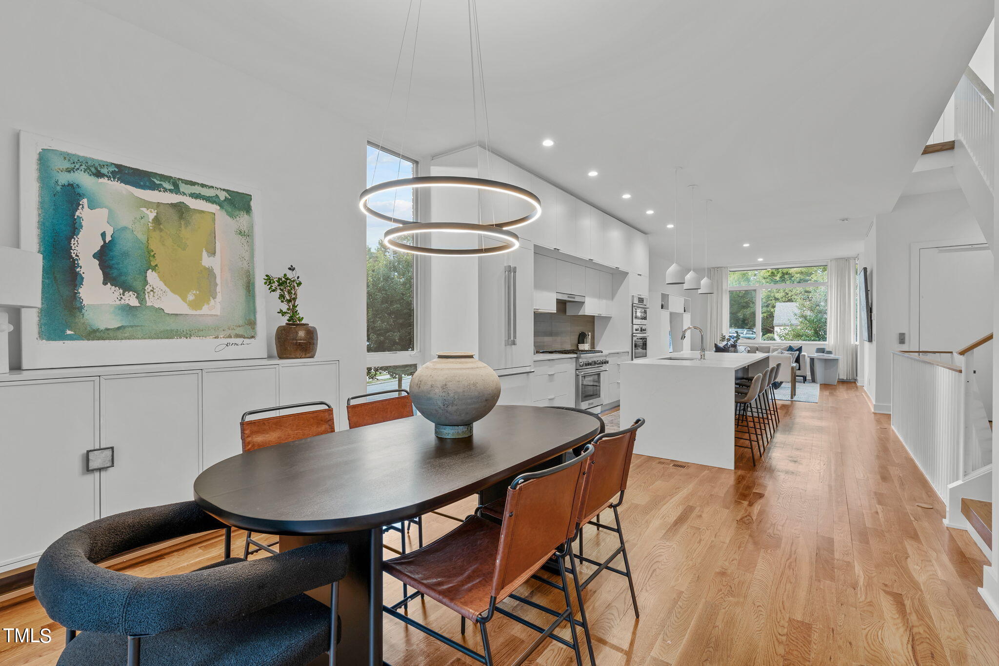 2329 Clark Avenue Raleigh, NC 27607 - Photo 10 of 34 a view of a dining room with furniture and wooden floor