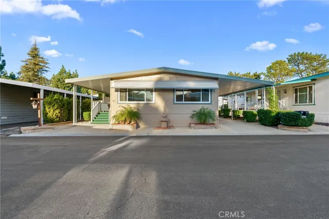 a front view of house with yard and green space