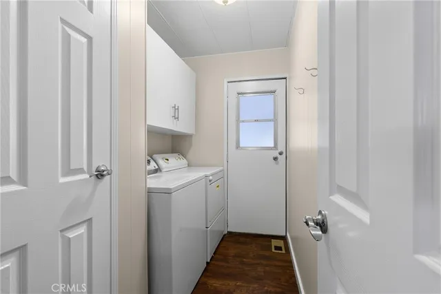 a room that has a sink and a wooden floor