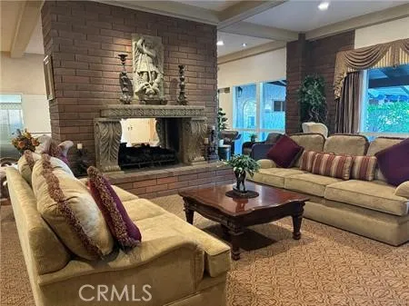 a dining room with furniture a rug and a large window