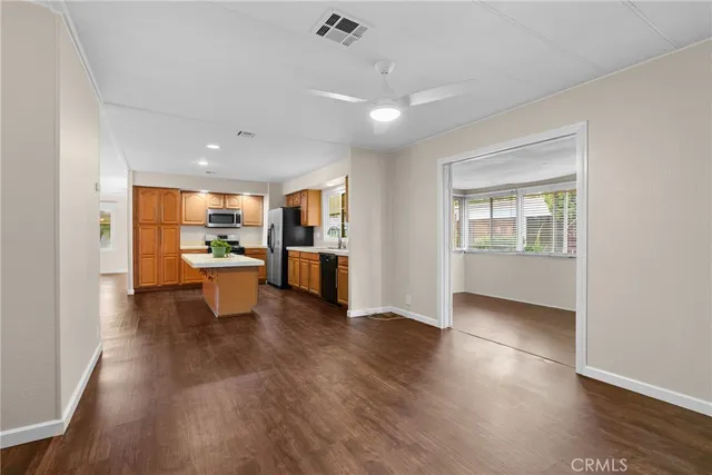 a view of kitchen and dining room with wooden floor