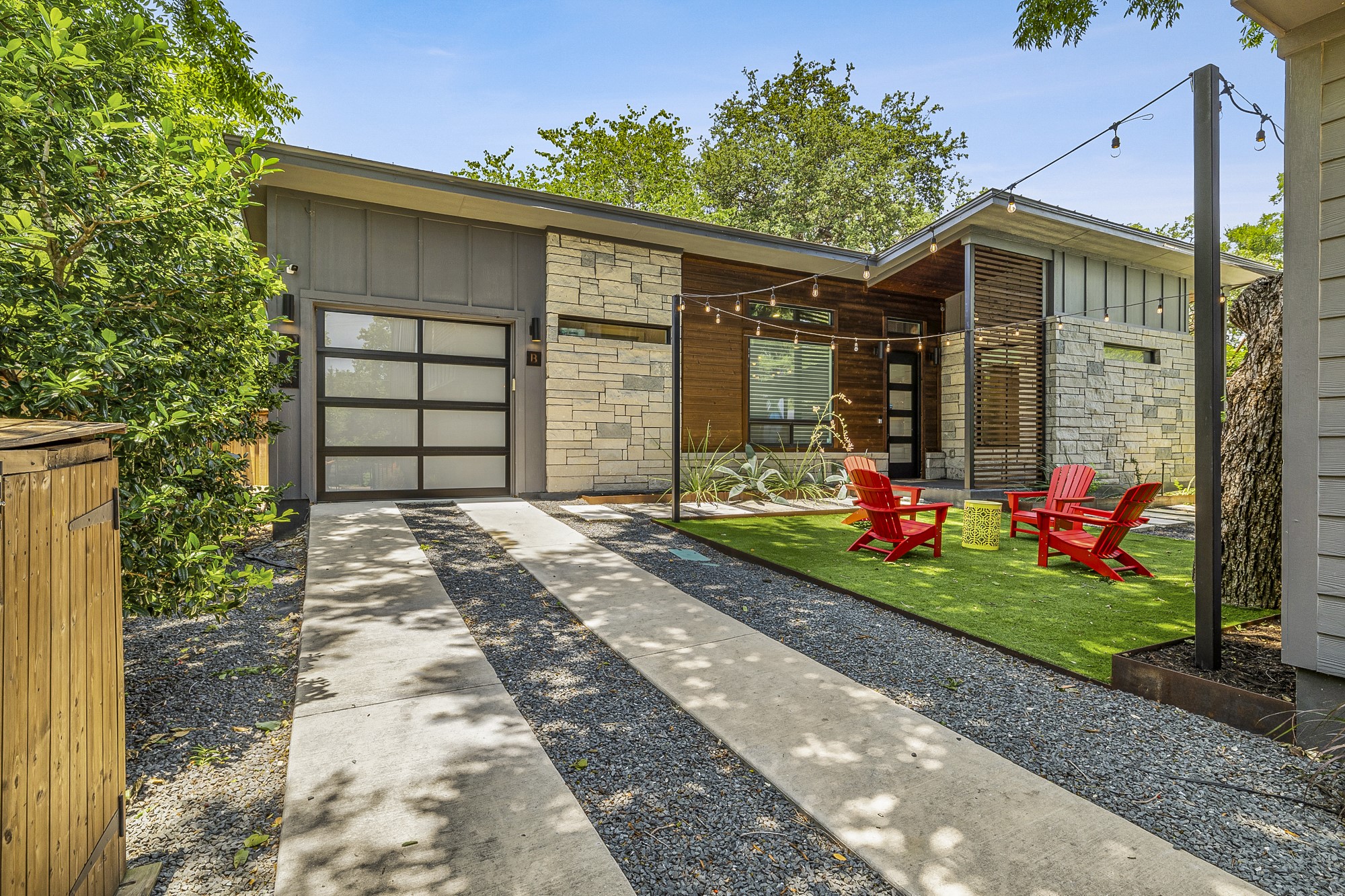 2414 Kinney Road Austin, TX 78704 - Photo 31 of 40 a front view of a house with a yard and potted plants