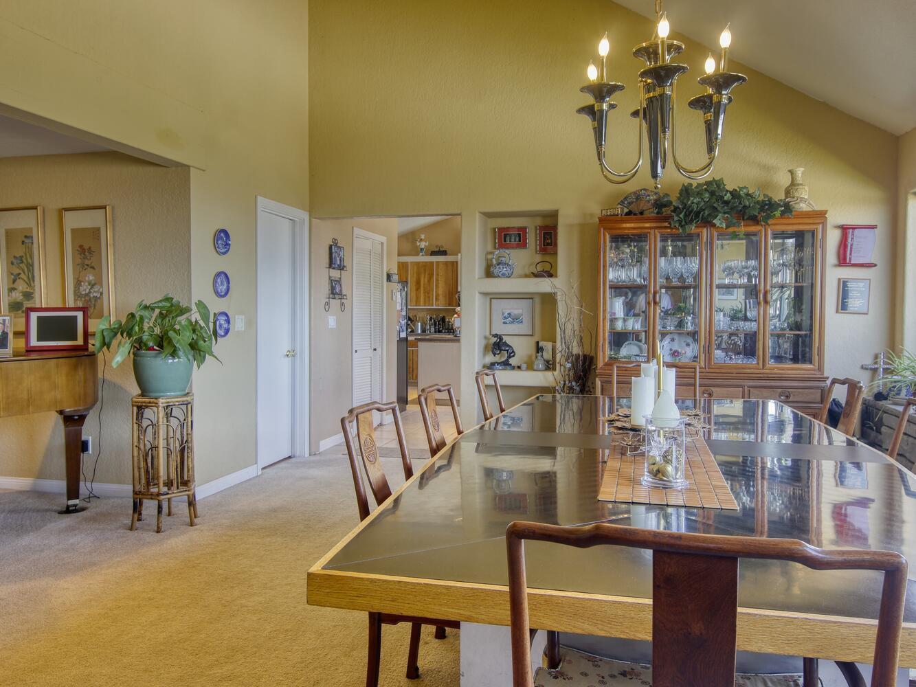 23760 El Rancho Drive Tehachapi, CA 93561 - Photo 12 of 40 a view of a dining room with furniture and chandelier