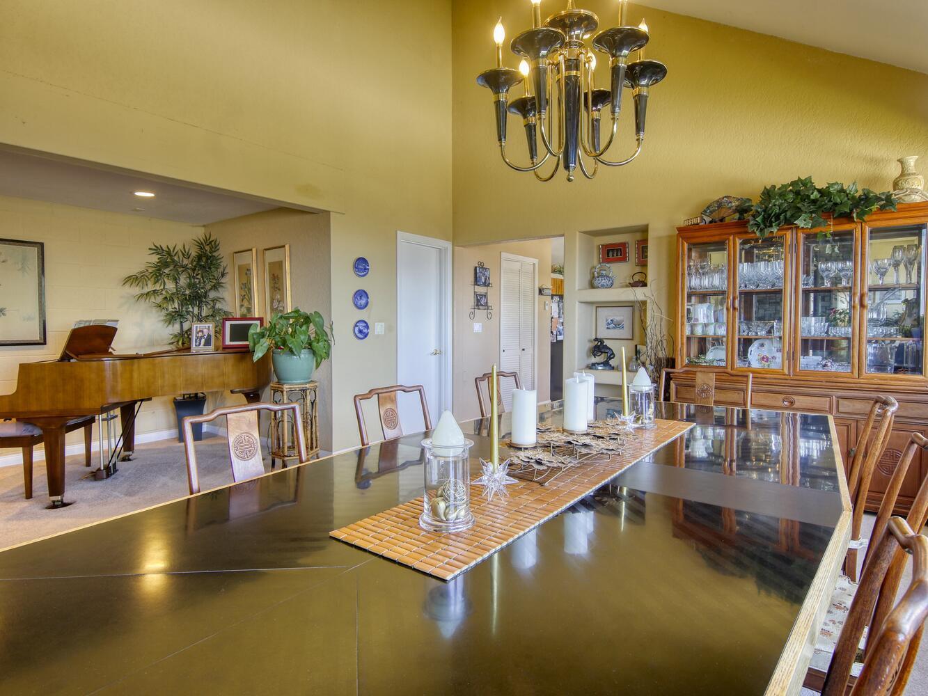23760 El Rancho Drive Tehachapi, CA 93561 - Photo 15 of 40 a view of a dining room with furniture and floor to ceiling window