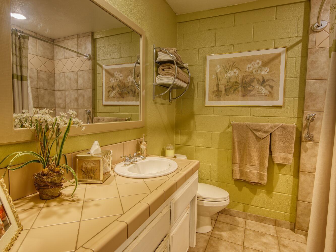 23760 El Rancho Drive Tehachapi, CA 93561 - Photo 26 of 40 a bathroom with a granite countertop sink a toilet and shower