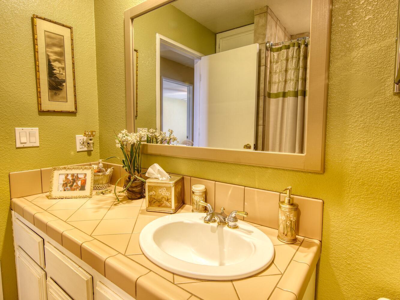 23760 El Rancho Drive Tehachapi, CA 93561 - Photo 27 of 40 a bathroom with a sink and a mirror