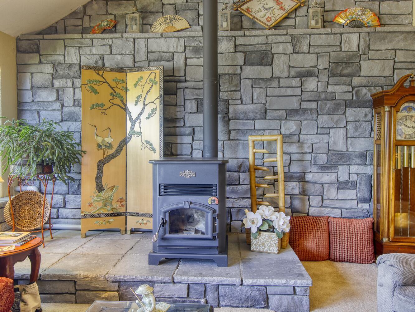 23760 El Rancho Drive Tehachapi, CA 93561 - Photo 9 of 40 a living room with fireplace furniture and a fireplace