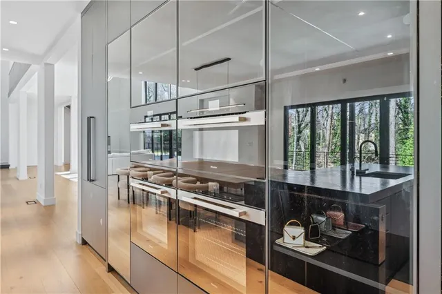 a large kitchen with a table and chairs