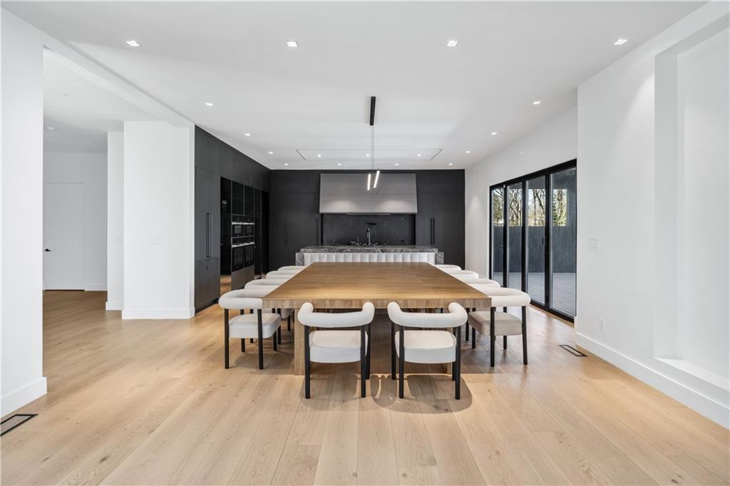 1355 Moores Mill Road Northwest Atlanta, GA 30327 - Photo 15 of 45 a large kitchen with a table and chairs