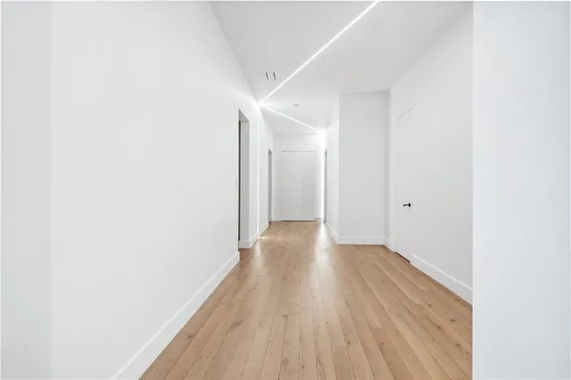 a bedroom with a large bed and a flat screen tv