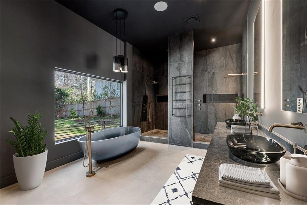 1355 Moores Mill Road Northwest Atlanta, GA 30327 - Photo 26 of 45 a living room with furniture and a potted plant