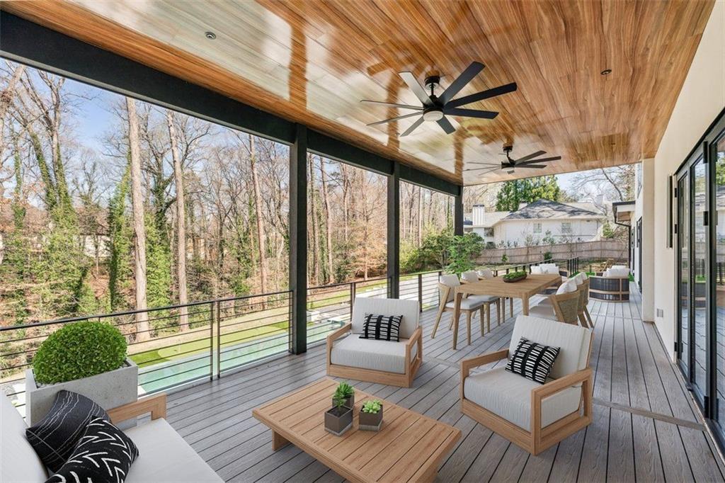 1355 Moores Mill Road Northwest Atlanta, GA 30327 - Photo 28 of 45 a living room with furniture and a large window
