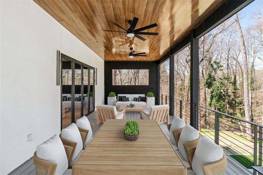 1355 Moores Mill Road Northwest Atlanta, GA 30327 - Photo 29 of 45 a view of a dining room with furniture window and wooden floor