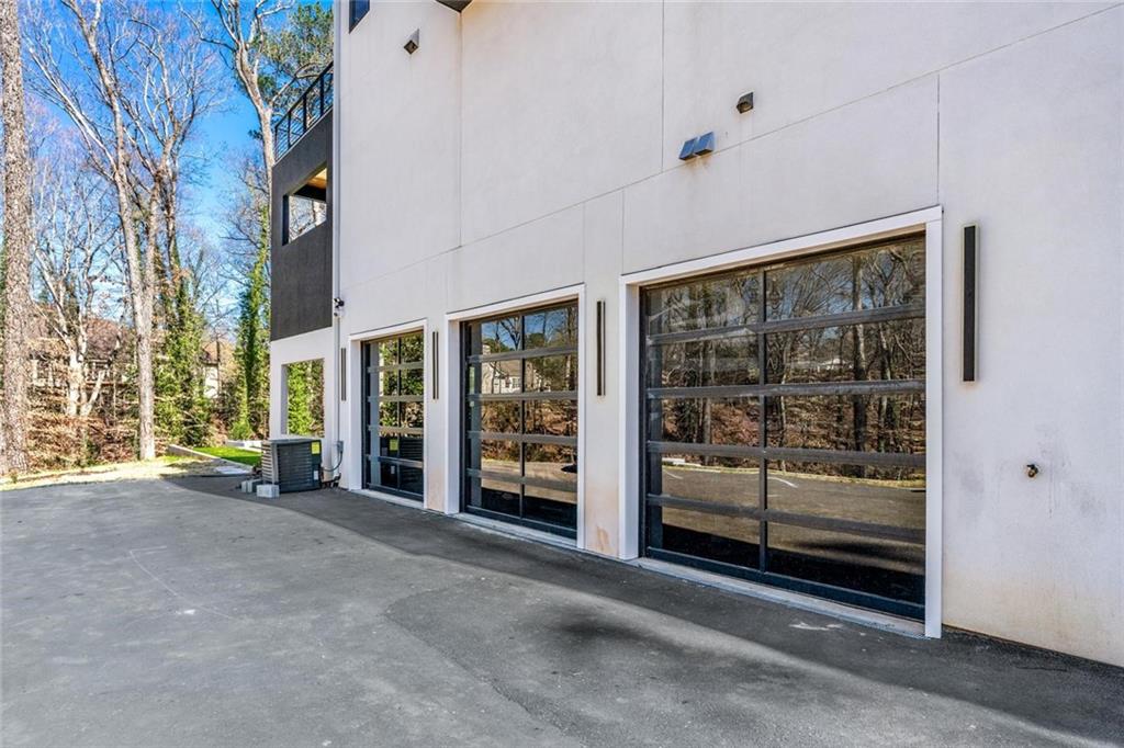 1355 Moores Mill Road Northwest Atlanta, GA 30327 - Photo 39 of 45 a view of a building with glass door