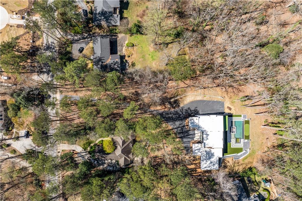 1355 Moores Mill Road Northwest Atlanta, GA 30327 - Photo 44 of 45 an aerial view of a house with a yard