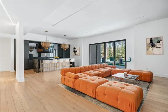 a bedroom with furniture and large window