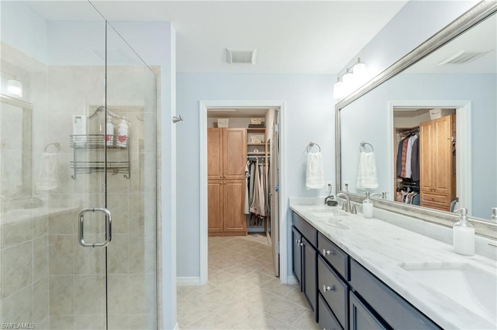5801 Declaration Court Ave Maria, FL 34142 - Photo 16 of 38 a bathroom with a double vanity sink mirror and double