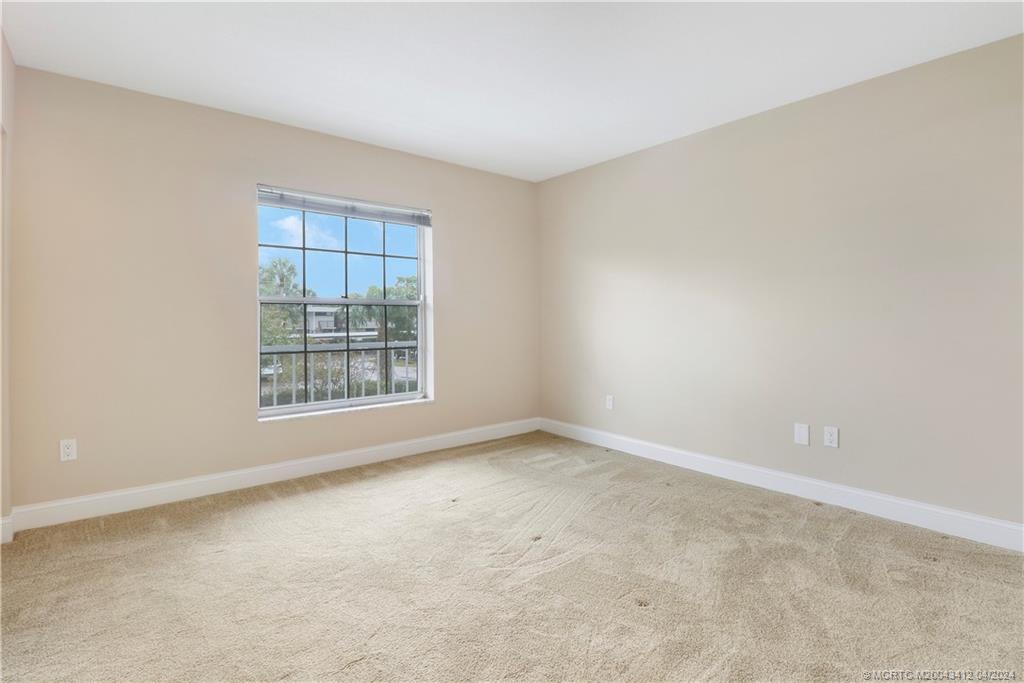 1864 Southwest Palm City Road, Unit 202 Stuart, FL 34994 - Photo 22 of 29 an empty room with a window