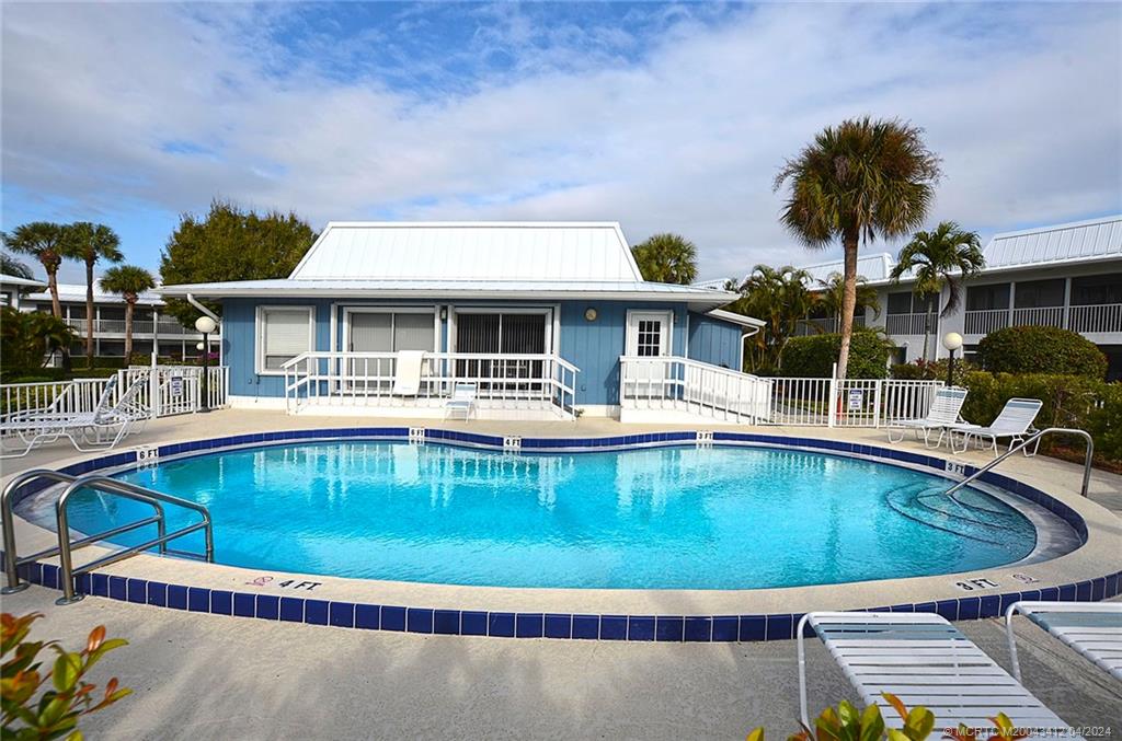 1864 Southwest Palm City Road, Unit 202 Stuart, FL 34994 - Photo 27 of 29 a view of a swimming pool with a patio